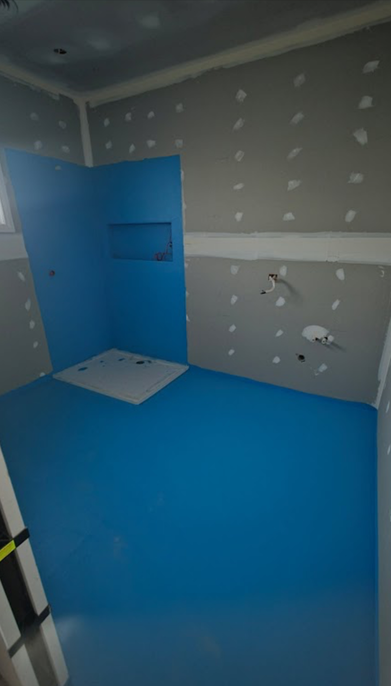 Waterproofing membrane applied before tiling